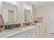 Bright bathroom features double vanity and decorative backsplash at 3000 E 112Th Ave # 102, Northglenn, CO 80233