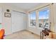 Well-lit bedroom featuring carpet floors, closet, and windows offering scenic views at 3000 E 112Th Ave # 102, Northglenn, CO 80233