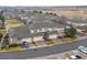 Aerial view of the townhome exteriors with attached garages and well-maintained driveways in a planned community at 3000 E 112Th Ave # 102, Northglenn, CO 80233