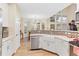 Bright eat-in kitchen features stainless steel appliances, farmhouse sink, and decorative tile backsplash at 3000 E 112Th Ave # 102, Northglenn, CO 80233