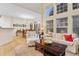 Bright, open-concept living area with high ceilings and natural light at 3000 E 112Th Ave # 102, Northglenn, CO 80233