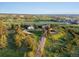 Aerial view of a country estate with rolling hills and mature trees at 8387 N Sunburst Trl, Parker, CO 80134