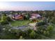 An aerial view of a home on a large lot with a private pond and putting green at 8387 N Sunburst Trl, Parker, CO 80134
