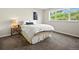 Bedroom featuring a large window for natural light and modern furnishings, with a calm and inviting atmosphere at 8387 N Sunburst Trl, Parker, CO 80134