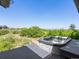 Enjoy outdoor living with a hot tub on a wooden deck with a green view at 8387 N Sunburst Trl, Parker, CO 80134