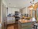 Well-appointed kitchen featuring a breakfast bar, stainless steel appliances, and a tile backsplash at 8387 N Sunburst Trl, Parker, CO 80134