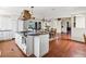 Open-concept kitchen with granite countertops, custom cabinets and an island at 8387 N Sunburst Trl, Parker, CO 80134