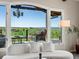 Living room featuring a large window with a stunning view of a green field and seating at 8387 N Sunburst Trl, Parker, CO 80134