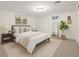 Bright bedroom features a large bed, modern decor, and a neutral color palette to create a comfortable retreat at 2644 S Krameria St, Denver, CO 80222