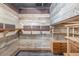 Custom closet design with wooden shelves, drawers, and plenty of storage space at 2644 S Krameria St, Denver, CO 80222