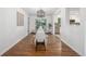 Bright dining room with hardwood floors, modern lighting, and sliding doors to the outdoor patio at 2644 S Krameria St, Denver, CO 80222