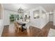 Open concept dining room boasts hardwood floors, modern lighting, and easy access to the kitchen at 2644 S Krameria St, Denver, CO 80222