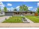 Charming brick home with a well-manicured lawn, sidewalk, and two car garage at 2644 S Krameria St, Denver, CO 80222