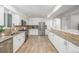 Spacious kitchen with granite counters, stainless appliances, tiled backsplash, and ample cabinet space at 2644 S Krameria St, Denver, CO 80222