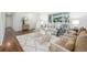 Cozy living room features wood floors, comfortable seating, and stylish decor at 2644 S Krameria St, Denver, CO 80222