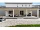 Spacious covered patio with outdoor furniture and grill, great for entertaining and enjoying the backyard at 1369 E Witherspoon Dr, Elizabeth, CO 80107