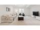 Spacious finished basement with a cozy seating area and natural light from a window at 1369 E Witherspoon Dr, Elizabeth, CO 80107