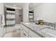 Bright bathroom featuring double sinks with granite countertops and modern fixtures at 1369 E Witherspoon Dr, Elizabeth, CO 80107