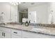 Bathroom featuring granite countertops, double vanity, and modern fixtures at 1369 E Witherspoon Dr, Elizabeth, CO 80107