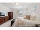Bedroom showcasing neutral walls, carpeted floors, TV, and view of the outside at 1369 E Witherspoon Dr, Elizabeth, CO 80107