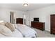 Cozy bedroom with neutral decor, carpet, and dark wood furnishings at 1369 E Witherspoon Dr, Elizabeth, CO 80107