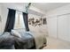 Stylish bedroom with a hanging chair, personal decorations, and white walls for a bright and modern feel at 1369 E Witherspoon Dr, Elizabeth, CO 80107