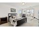Inviting bedroom with a comfortable bed, plenty of natural light, and dresser at 1369 E Witherspoon Dr, Elizabeth, CO 80107