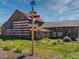 Rustic barn featuring a prominent American flag mural and decorative signage with distance to points of interest at 1369 E Witherspoon Dr, Elizabeth, CO 80107