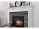 Stone fireplace with white mantel and decorative accents adds warmth and charm at 1369 E Witherspoon Dr, Elizabeth, CO 80107