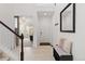 Bright and airy foyer featuring a staircase, a decorative mirror, and a stylish bench with ample storage at 1369 E Witherspoon Dr, Elizabeth, CO 80107