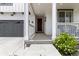 Inviting front porch with a cozy seating area, complemented by lush landscaping and a modern front door at 1369 E Witherspoon Dr, Elizabeth, CO 80107