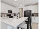 Bright kitchen with white countertops, island seating, and stainless-steel appliances at 1369 E Witherspoon Dr, Elizabeth, CO 80107