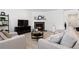 Comfortable living room featuring a fireplace, modern furnishings, and ample seating at 1369 E Witherspoon Dr, Elizabeth, CO 80107