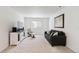 Comfortable living room with neutral tones, plush seating, and a stylish media console at 1369 E Witherspoon Dr, Elizabeth, CO 80107