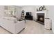 Cozy living room with a fireplace, comfortable seating, and stylish decor, creating an inviting atmosphere at 1369 E Witherspoon Dr, Elizabeth, CO 80107