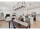 Spacious living area with a modern dining table, a cozy living room, and a stylish, well-equipped kitchen at 1369 E Witherspoon Dr, Elizabeth, CO 80107
