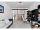 Bright home office with sliding door and a view of the staircase at 1369 E Witherspoon Dr, Elizabeth, CO 80107