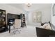 Home office with built-in bookshelves, a desk, and seating, creating a functional workspace at 1369 E Witherspoon Dr, Elizabeth, CO 80107