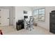Bright office space featuring neutral walls, a desk, and a large window for natural light at 1369 E Witherspoon Dr, Elizabeth, CO 80107