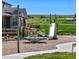 Neighborhood playground with merry-go-round, slide, and park bench at 1369 E Witherspoon Dr, Elizabeth, CO 80107