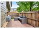 Cozy brick patio with a gray outdoor sofa and a wooden fence, perfect for outdoor relaxation at 9138 Gale Blvd # 2, Thornton, CO 80260