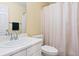 Bright bathroom featuring a white vanity, neutral walls, and a shower with a white curtain at 9138 Gale Blvd # 2, Thornton, CO 80260