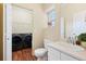 Bright bathroom with laundry area, modern fixtures, and neutral color palette at 9138 Gale Blvd # 2, Thornton, CO 80260