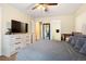 Spacious bedroom with a light-colored dresser, comfy bed, and neutral decor at 9138 Gale Blvd # 2, Thornton, CO 80260