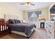 Cozy bedroom with a bed, dresser, and window at 9138 Gale Blvd # 2, Thornton, CO 80260