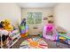 Bright bedroom with playful decor, storage, and a window for natural light at 9138 Gale Blvd # 2, Thornton, CO 80260