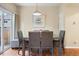 Dining area features a modern table, seating for four, and sliding door access to the exterior at 9138 Gale Blvd # 2, Thornton, CO 80260