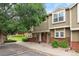 Townhouse exterior showcasing a landscaped yard and community green space, perfect for outdoor enjoyment at 9138 Gale Blvd # 2, Thornton, CO 80260
