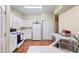 Functional kitchen features white cabinets, laminate counters, and essential appliances for meal preparation at 9138 Gale Blvd # 2, Thornton, CO 80260