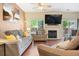 Inviting living room boasts a cozy fireplace, hardwood floors, and ample natural light at 9138 Gale Blvd # 2, Thornton, CO 80260